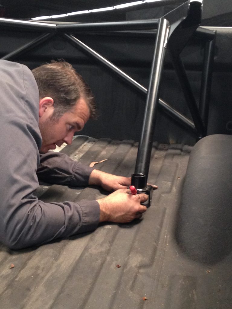 Rebel Technician Chris Paul installing ReadyLIFT Off-Road Bedcage